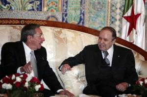 Algeria's President Abdelaziz Bouteflika (R) speaks with his Cuban