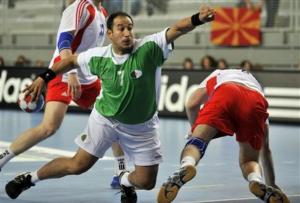 Algeria's Hichem Boudrali throws during the Group C match