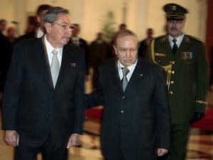 Algeria's President Abdelaziz Bouteflika (R) welcomes his Cuban counterpart