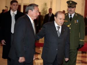 Algeria's president Abdelaziz Bouteflika (R) welcomes his Cuban counterpart