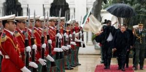 Cuban President Raul Castro, second right, reviews the Presidential