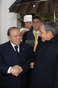 Algerian President Abdelaziz Bouteflika, left, greets Cuban President Raul