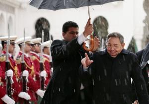 Cuba's President Raul Castro reviews an honour guard during