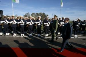 Algeria's President Abdelaziz Bouteflika walks past honour guards upon