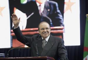 Algeria's President Abdelaziz Bouteflika waves during a speech to