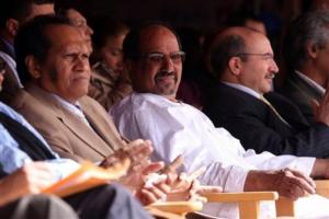 Saharawi President-in-exile Mohammed Abdelaziz, center, sits between regional governor
