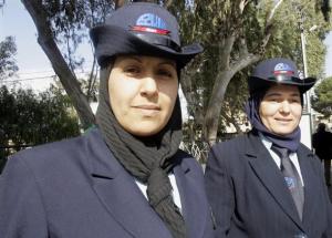 Ghazali Ghania (L), 33, and Denni Fatiha, 48, sit