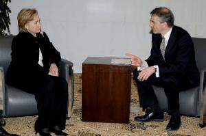 U.S. Secretary of State Hillary Clinton (L) talks with