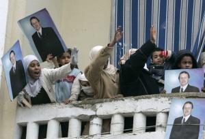 Supporters of Algeria's President Abdelaziz Bouteflika cheer during a presidential