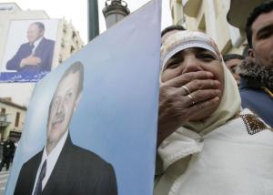 Supporters of Algeria's President Abdelaziz Bouteflika cheer during a presidential
