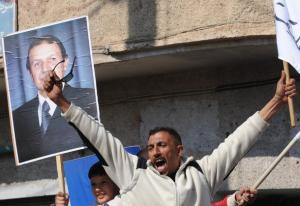 An Algerian man shouts slogans in support of President Abdelaziz