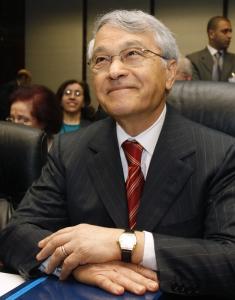 Algeria's Oil Minister Chakib Khelil listens to journalists at the
