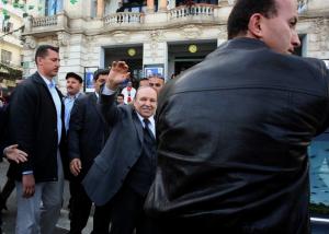 Algerian President Abdelaziz Bouteflika (C) is surrounded by his bodyguards