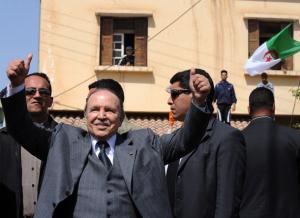 Algerian President Abdelaziz Bouteflika gestures to his supporters during an