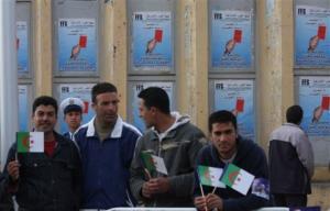 Supporters of Algerian President Abdelaziz Bouteflika await his arrival in