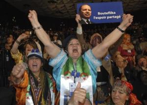 Supporters of Algerian President Abdelaziz Bouteflika react during a campaign