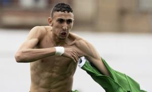 Algeria's Bendahmane Nadir celebrates the team's goal against Burkina Faso