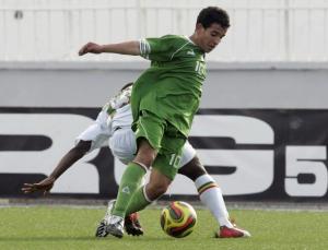 Algeria's Bezaz Abdelhakim (front) fights for the ball with Kabre