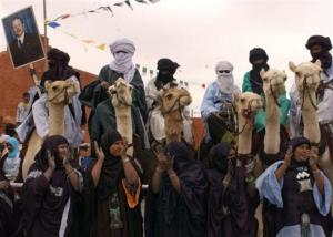 Algerians on camels and women in traditional dress welcome Algeria's