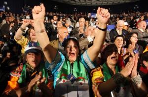Supporters of Algerian President Abdelaziz Bouteflika shout slogans during an