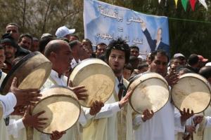 Members of a local dance troupe perform during an election