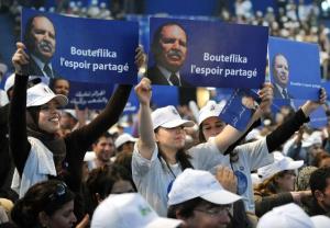 Supporters of Algerian President Abdelaziz Bouteflika, chant slogans during his