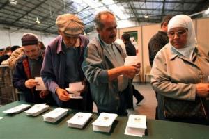 Algerian citizens residing in France choose their ballot, in Marseille,