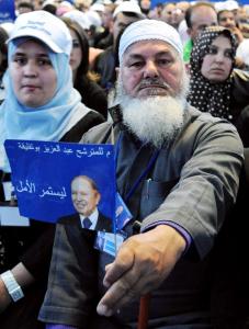 Supporters of Algerian President Abdelaziz Bouteflika, chant slogans during his
