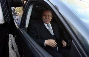 Algeria's President Abdelaziz Bouteflika smiles from his brother's car after