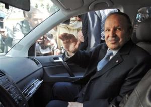 Algerian President Abdelaziz Bouteflika waves as he arrives at his
