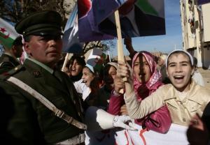 Children greet Algeria's President Abdelaziz Bouteflika during his official