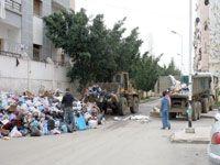 Cité EPLF à Bab-Ezzouar (Alger):  Un bull et un semi-remorque pour les ordures !