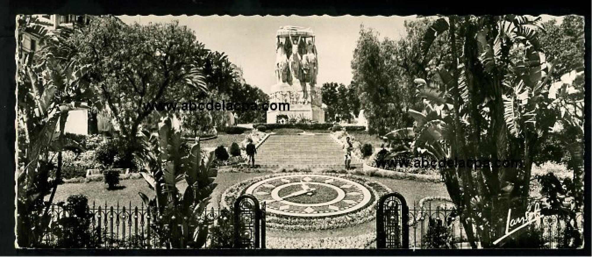 Alger - Rues  - L'horloge florale et Monument aux morts - Carte postale grand format, 21,5cm x 9 cm