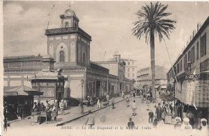 BONE  ALGERIE LA RUE BUGEAUD ET LE MARCHE ARABE CPA TRES ANIMEE