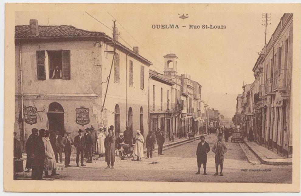 cpa Algerie Guelma Rue Saint Louis Animée Petit marchand Publicité Anisette , taco