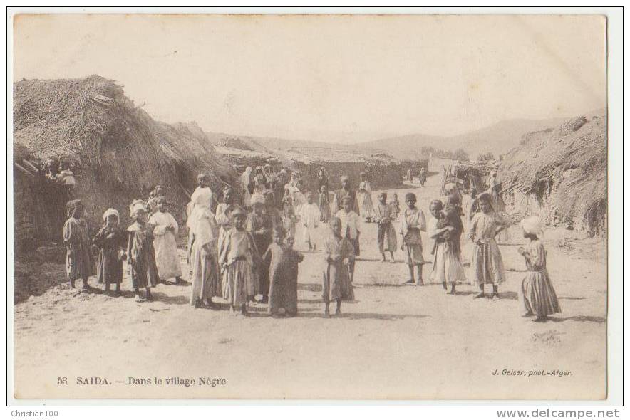SAIDA  DANS LE VILLAGE NEGRE - CPA  ECRITE EN 1916 - 2 SCANS -
