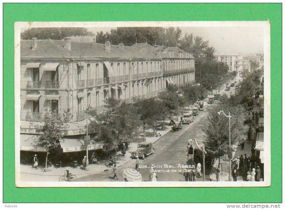 CPA  ALGERIE  -  SIDI-BEL-ABBES  -  509  Avenue de la Gare  ( en 1938 )  Animée Autos