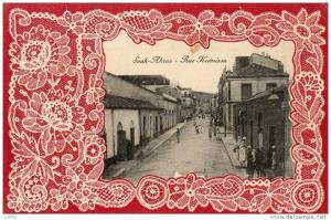 Jolie CPA  SOUK AHRAS - Rue Krémissa  - animée -  Effet dentelle sur fond rouge