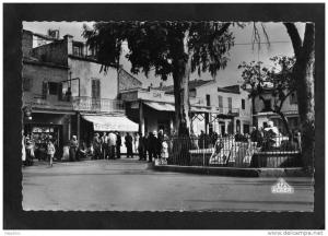 CPSM - TEBESSA - Place Carnot - ( Librairie Hachette - Epicerie Moderne - Café - Affiches de Cinéma )