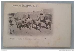 biskra - une rue du village nègre - chocolat masson , paris  animation - attelage - chameaux