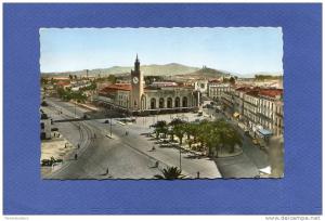 Z - Algérie - BONE - La place de la Gare - commerces - horloge - voitures - palmier - Annaba