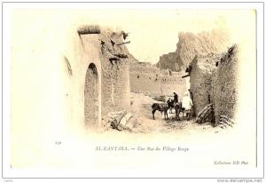 El Kantara - Une rue du Village Rouge - habitants avec des ânes - Dos vierge