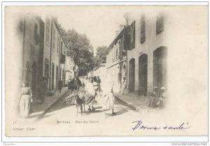 cpa bon etat   miliana , rue du caire ,  adresse au verso , timbre oblitéré, animation