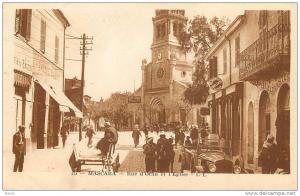 ALGERIE - MASCARA - RUE D'ORAN ET L'EGLISE - QUINCAILLERIE M. LUNEAU - MAGASIN  AUX ELEGANTES