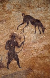 Djanet, Algérie. Voici un homme avec un arc et un chien de la période pastorale de l\'art saharien.