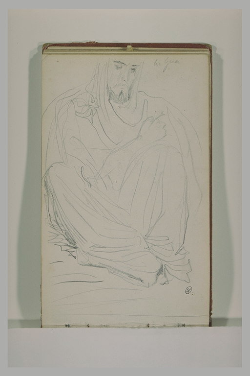 Un arabe assis à terre