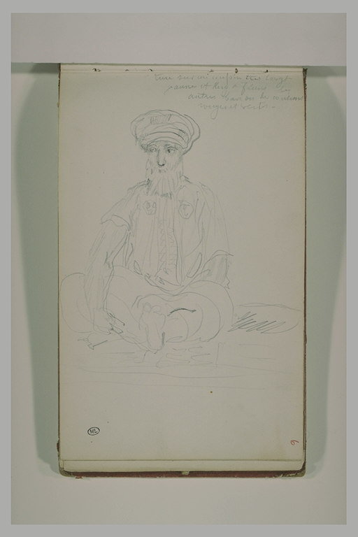 Un arabe assis à terre, coiffé d'un turban