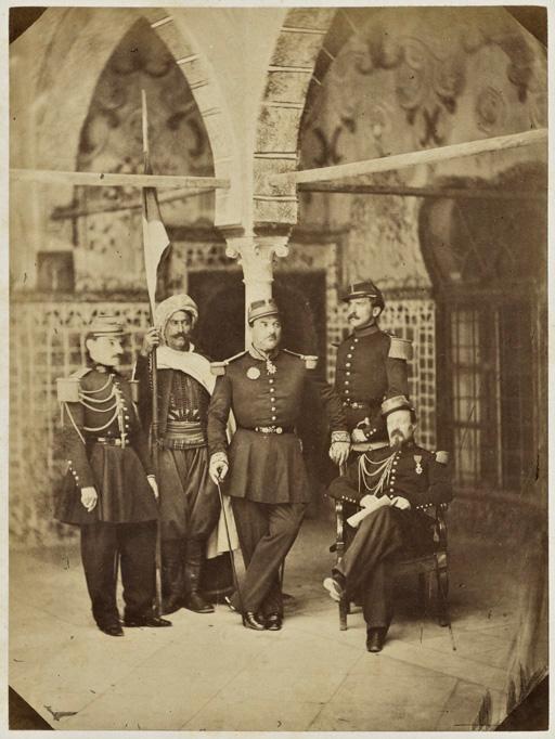 M. le général de brigade Périgot, commandant la subdivision de Bône et son état-major [commandant par intérim de celle de Constantine et ses officiers d'ordonnance dont Lacoste, chef d'escadron d'état-major (assis) (Image de propagande coloniale)