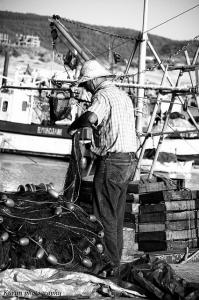 Pêcheur Rangeant ses Filets