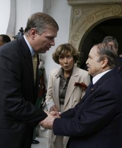 Algeria's president Abdelaziz Bouteflika (R) shakes hands with Britain's